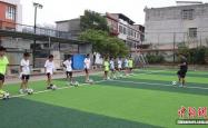 爱游戏体育官网-湖南江华校园足球“面上开花” 编写乡土足球教材